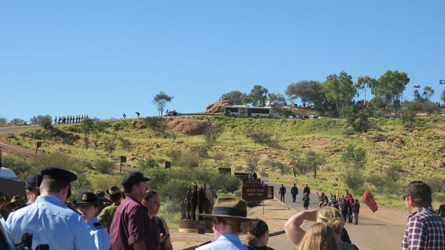 Hundreds marched up Anzac Hill in Alice Springs for the midmorning service.