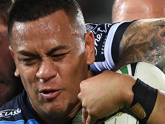 Phillip Sami of the Titans is tackled during the Round 25 NRL match between the Gold Coast Titans and the North Queensland Cowboys at Cbus Super Stadium on the Gold Coast, Saturday, September 1, 2018. (AAP Image/Dave Hunt) NO ARCHIVING, EDITORIAL USE ONLY