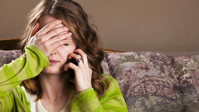 Attractive young woman receives bad news via mobile phone. Picture: iStock