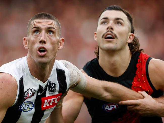 MELBOURNE, AUSTRALIA - APRIL 25: Darcy Cameron of the Magpies and Sam Draper of the Bombers compete in a ruck contest during the 2024 AFL Round 07 match between the Essendon Bombers and the Collingwood Magpies at the Melbourne Cricket Ground on April 25, 2024 in Melbourne, Australia. (Photo by Dylan Burns/AFL Photos via Getty Images)