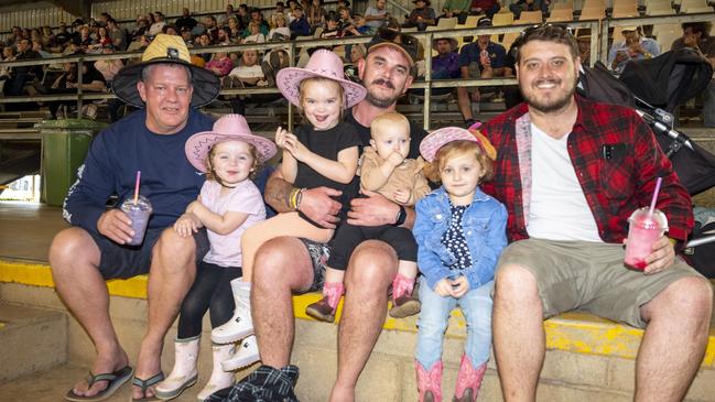 (from left) Anthony Martin, Olivia Purcell, Charlotte Purcell, Trent Purcell, Piper Turner, Aurora Turner and Michael North at Meatstock, Toowoomba Showgrounds. Friday, April 8, 2022. Picture: Nev Madsen.