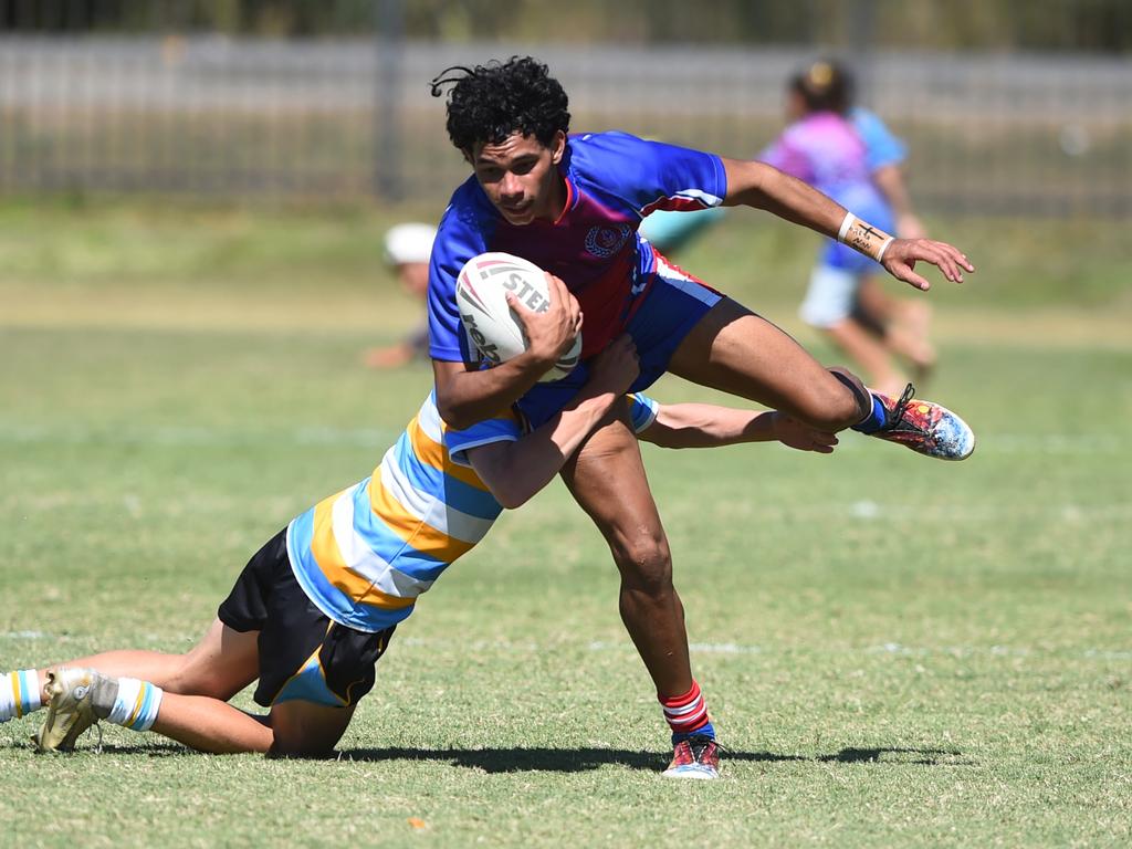 Boys Rugby League State Championship held at Northern Division, Brothers Leagues ground, Townsville. 16-18 years. Peninsula (stripe) v Darling Downs (blue/purple). Aaron Hinchey of Warwick SHS