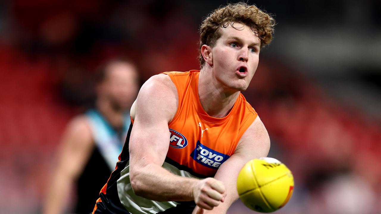 SYDNEY, AUSTRALIA - JUNE 16: Tom Green of the Giants handballs to a team mate during the round 14 AFL match between Greater Western Sydney Giants and Port Adelaide Power at ENGIE Stadium, on June 16, 2024, in Sydney, Australia. (Photo by Brendon Thorne/AFL Photos/via Getty Images)