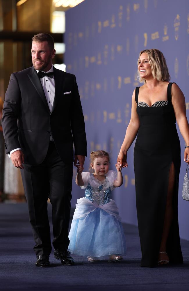 Aaron Finch and Amy Finch arrive with their daughter Esther. Picture: by Jonathan DiMaggio/Getty Images for Cricket Australia