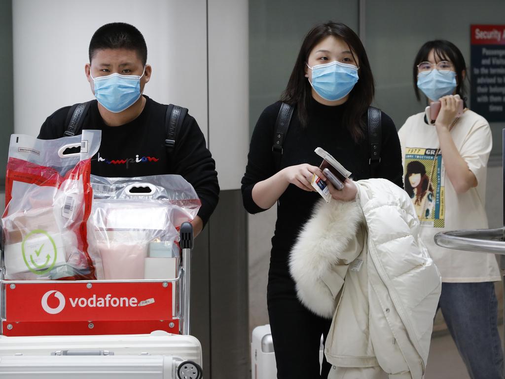 People seen wearing masks at Sydney airport due to the virus. Picture: Chris Pavlich