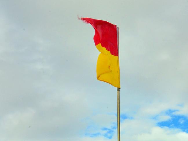 Generic lifesaver. Lifeguard. Beach patrol. Coolum Beach. Beach flags. Surf Lifesaving. Beach safety. Safety. Swimming.