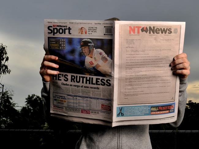 Generic man reading newspaper photo