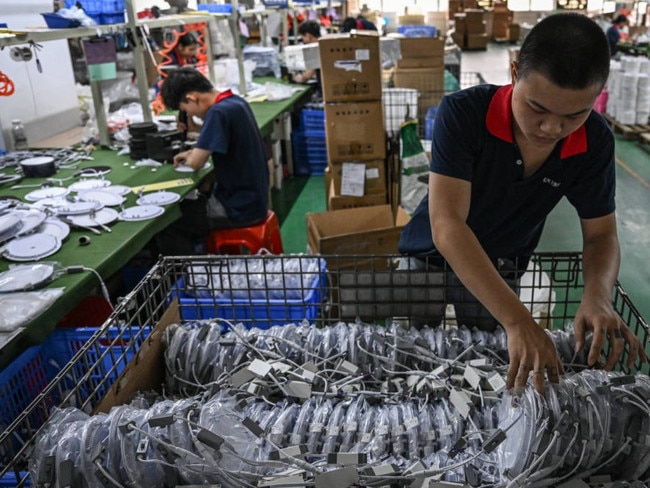 An assembly line at a factory in southern China. Picture; Getty Images.