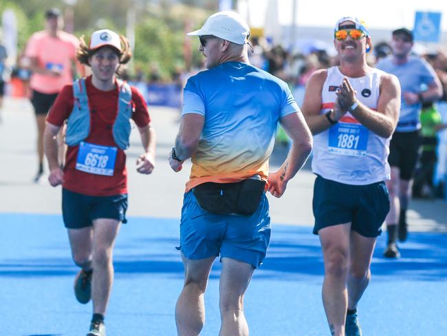 Kieran Douglas trots backwards after finishing the 2023 42km Gold Coast Marathon event. Picture: Glenn Campbell