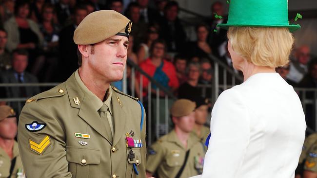 Governor-General Quentin Bryce congratulates Corporal Ben Roberts-Smith after he was awarded a Victoria Cross in 2011.