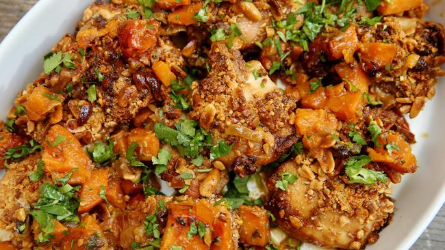 Top taste: This recipe provides a peanut-crusted topping for the chicken, with a base of tomato and potato. Picture: Andy Rogers