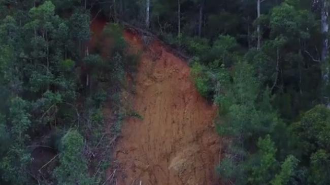 One of the 112 slips along the Springbrook-Gold Coast Road via Mudgeeraba which has kept it closed to traffic since Cyclone Debbie flooding three months ago.