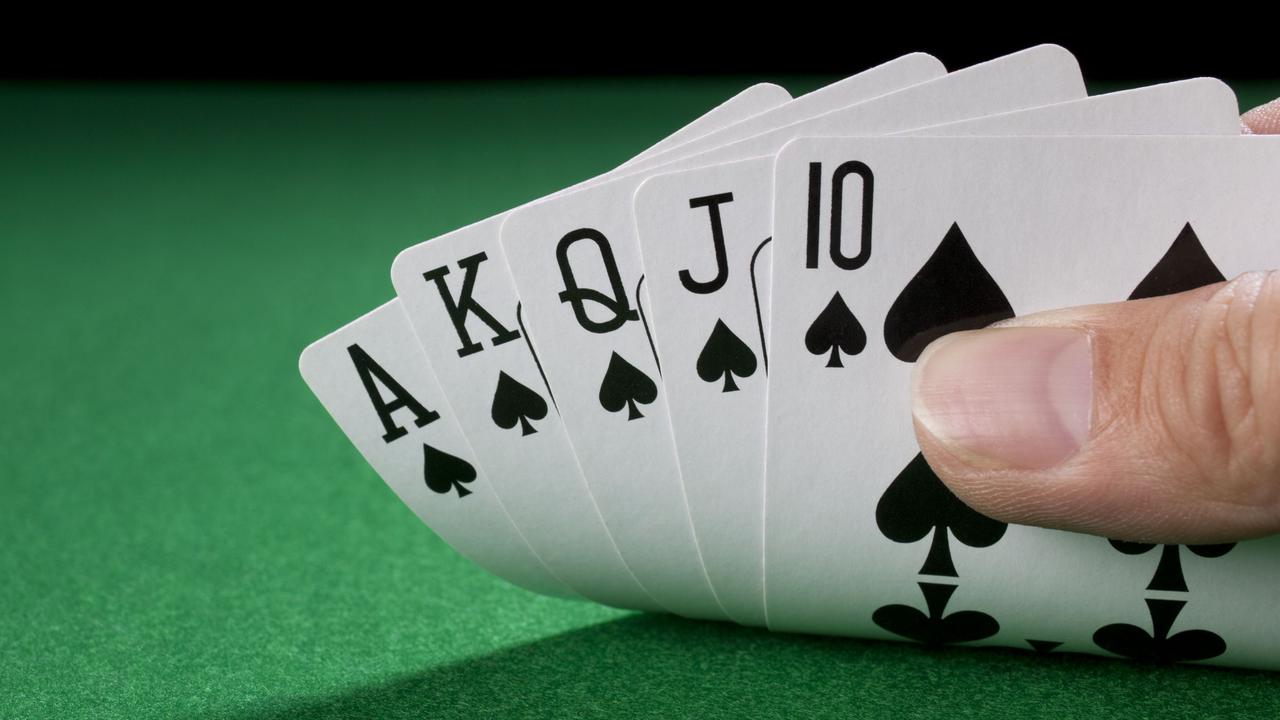 An Adelaide card dealer who handed out two rare royal flush jackpots at the same poker venue within 15 months has said she “would never cheat.”