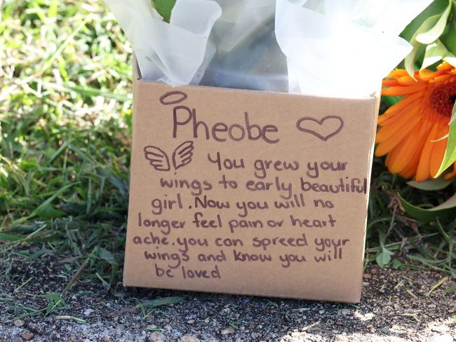 Floral tributes and note outside of Pheobe Bishop’s share house in Gin Gin. Picture: Liam Kidston.