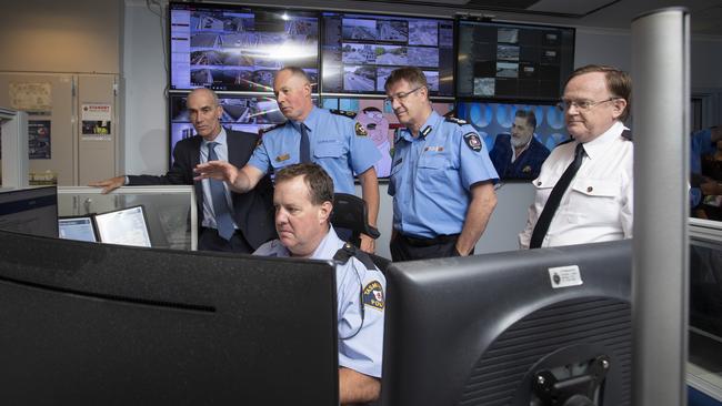 Tasmania Police Assistant Commissioner Scott Tilyard (second from left) shows off the new emergency dispatch system to (L-R standing Mike Foster, CEO of Fijitsu Australia, Tasmania Fire Service Chief Officer Chris Arnol and Ambulance Tasmania CEO Neil Kirby. Picture: Luke Bowden