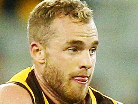 MELBOURNE, AUSTRALIA - MARCH 24:  Tom Mitchell of the Hawks runs with the ball from Steele Sidebottom of the Magpies during the round one AFL match between the Hawthorn Hawks and the Collingwood Magpies at Melbourne Cricket Ground on March 24, 2018 in Melbourne, Australia.  (Photo by Michael Dodge/Getty Images)