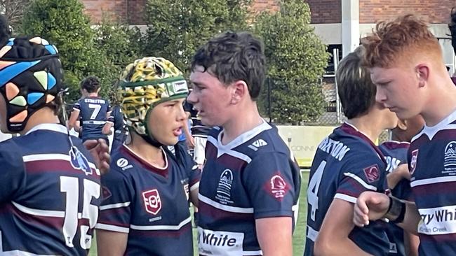 Mountain Creek SHS and STretton State College players shake hands.