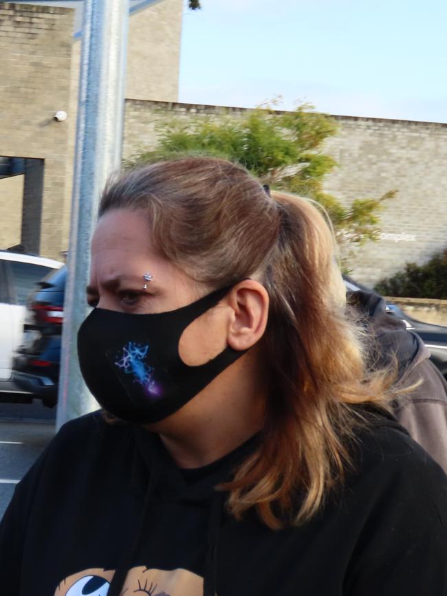 A family member of Bradley Tye Long stands in front of the sex offender, shielding him from the media. Picture: Arj Ganesan