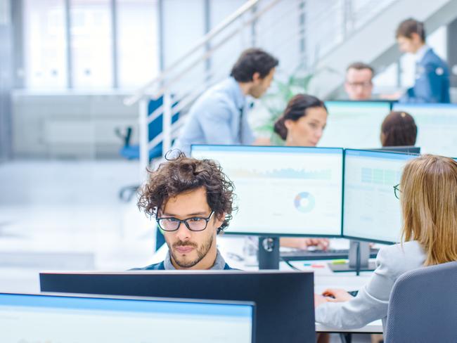 Big Busy Corporate Office with Two Rows off Businessmen and Businesswomen Working on Desktop Computers. Bright Open Space Office with Businesspeople and Salespeople