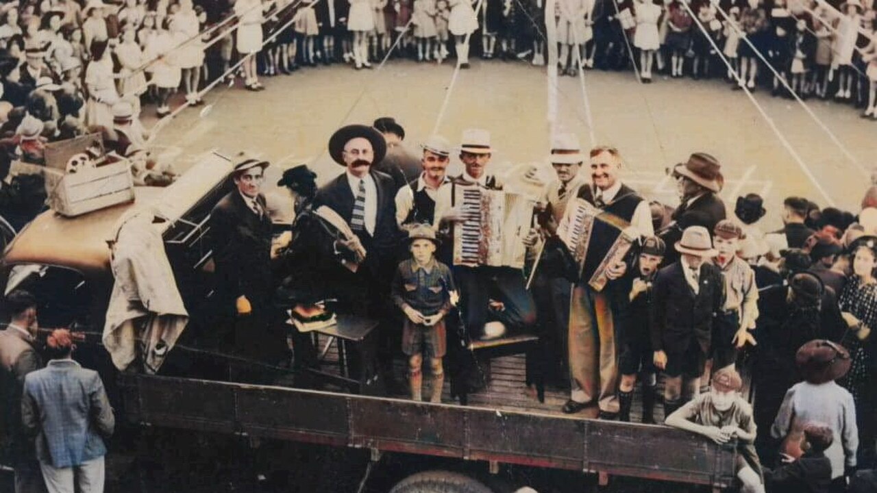 Part of the Garnett Laffan Collection in the state library, this image shows a patriotic fete held on Bourbong St some time during World War II. Band members, including Garnett Laffan pictured playing the piano accordion, play on the back of a truck. Picture: Bundaberg Regional Libraries.