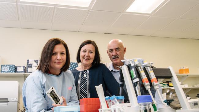 Dr Anna Brown, Head of Molecular Oncology at the Centre for Cancer Biology, SA Pathology with Deb and Peter Owens, whose son Michael died one year ago this month from blood cancer. Picture: Morgan Sette/AAP