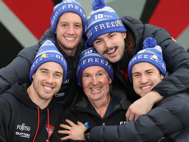 Neale Daniher with senior Essendon players captain Zach Merritt, Darcy Parish, Sam Draper and Andrew McGrath. Picture: David Caird