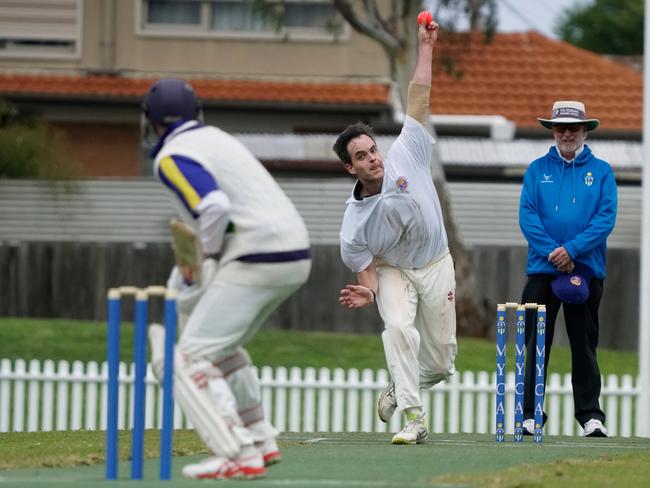 NSW bowler Matt Cole goes at Victoria’s captain Mark Cooper, with former international umpire Bill Sheahan looking on. Picture: Valeriu Campan