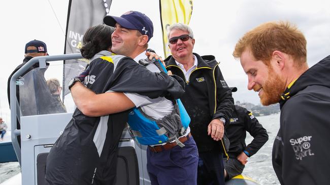 The royal couple shared a hug with a friend. Picture: Chris Jackson/Getty Images