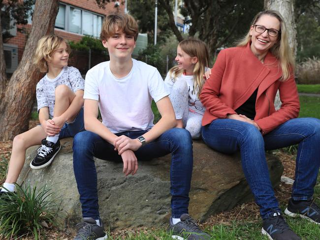 23/7/21:  Mum Delia Burrage with Hugo Bendeich 13, Jasper Bendeich 11 and Frankie Bendeich 9. Mum of 3 Delia says she would allow her kids to get vaccinated against Covid-19 and is excited to the the TGA ruling that it is now open to 12-15 year olds. Delia is an advocate of vaccinations in the community.John Feder/The Australian.