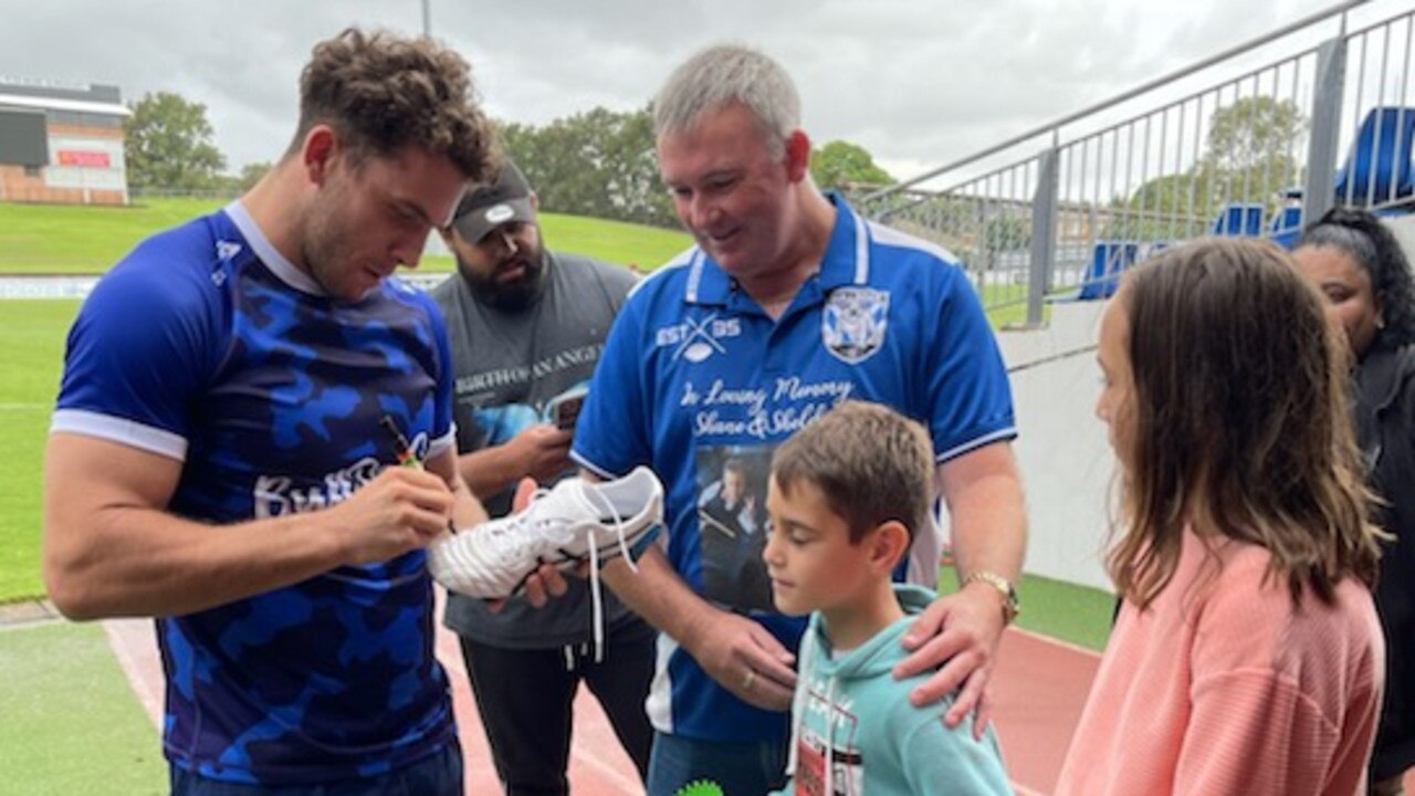 The Storeys receive Adam Elliott’s signed boots at the captain’s run before the Bulldogs game against the Panthers last weekend.