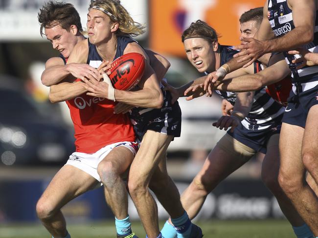 SANFL - South versus Norwood at Noarlunga, Flinders University Stadium. South's Jaidan Kappler tries to escape from Norwood's Cody Szust. 10 June 2019. Picture Dean Martin