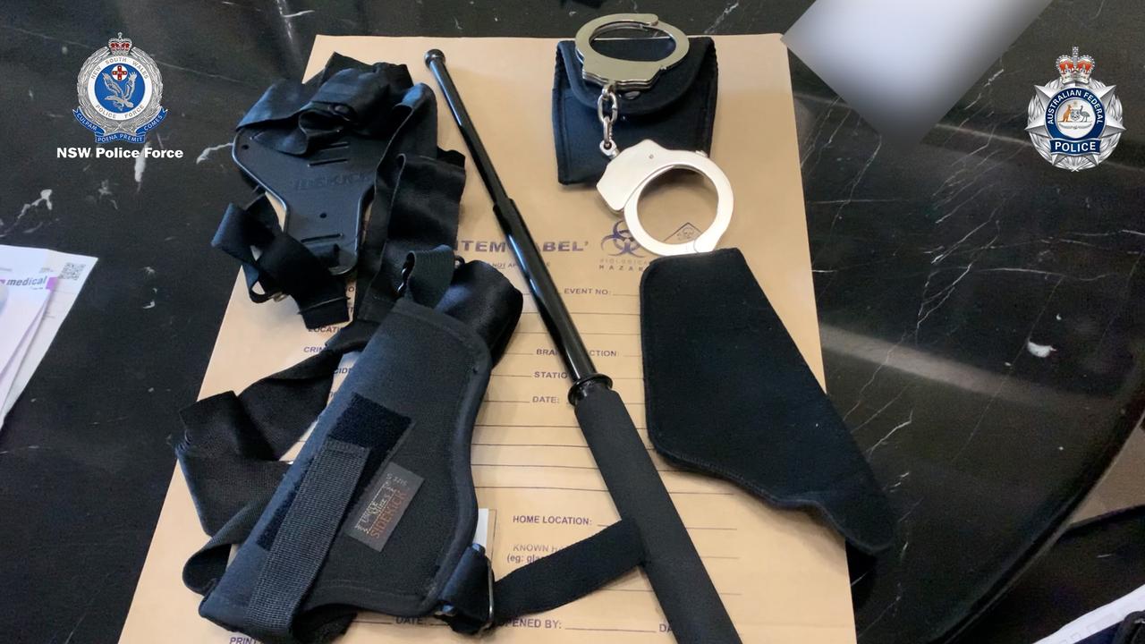 Criminal syndicates targeted under AFP-led Operation Ironside, specifically Operation Gili, in Bankstown NSW. Pictured: Hand Cuffs and a baton. Picture: AFP