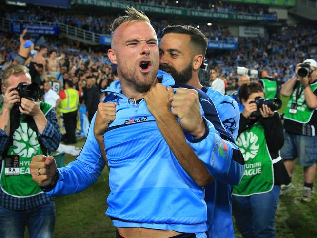 Jordy Buijs and Alex Brosque celebrate Sydney’s grand final win. Picture: Mark Evans