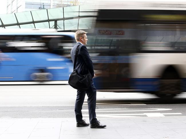 A commuter at Railway Square waits for the right service as Buses from the Inner West rush past.The First day of Private Company Transit Systems , taking over Region 6,  the Inner West Bus run,  from Transport NSW. Picture: John Appleyard