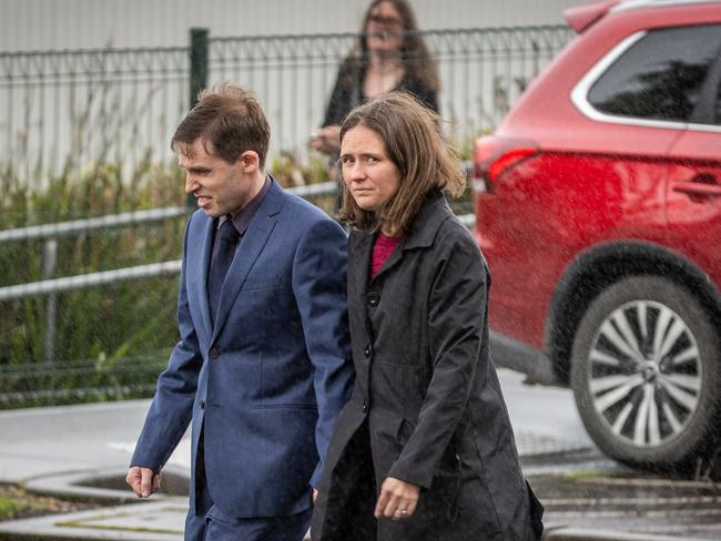 Rain soaked the mourners as they arrived at the memorial. Picture: Jake Nowakowski