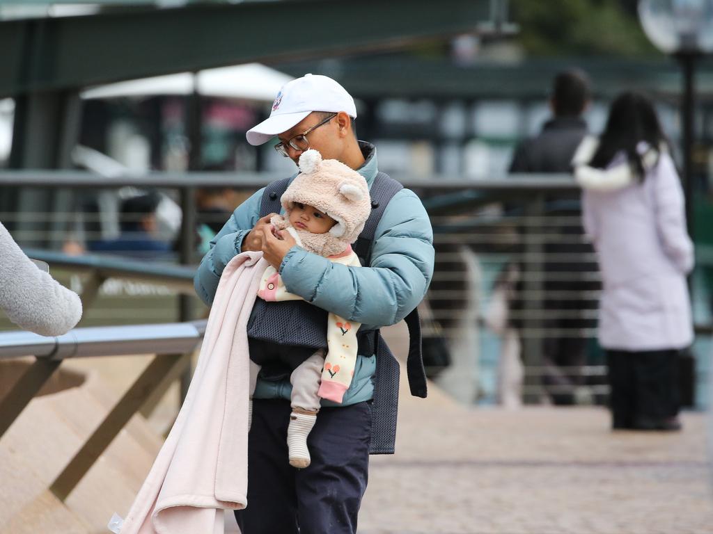 People near the Sydney Opera House forecourt as southeast Australia is shivering through a prolonged spell of bleak wintry weather that will linger for at least another week. Picture: Newswire / Gaye Gerard