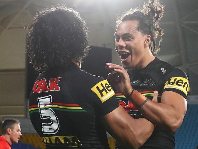 GOLD COAST, AUSTRALIA - SEPTEMBER 03: Brian To'o of the Panthers celebrates scoring a try with team mate Jarome Luai of the Panthers during the round 25 NRL match between the Parramatta Eels and the Penrith Panthers at Cbus Super Stadium, on September 03, 2021, in Gold Coast, Australia. (Photo by Chris Hyde/Getty Images)