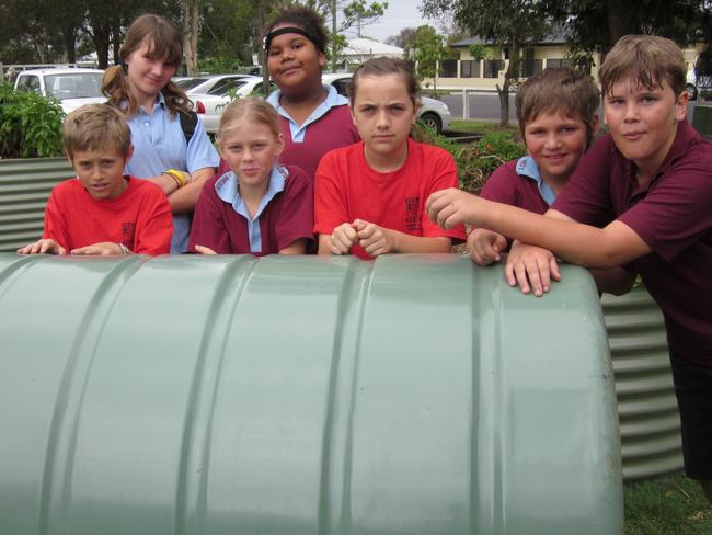 Students from Casino West Public School stand with a tank won by the school through a Rous Water competition in 2012. Photo Contributed