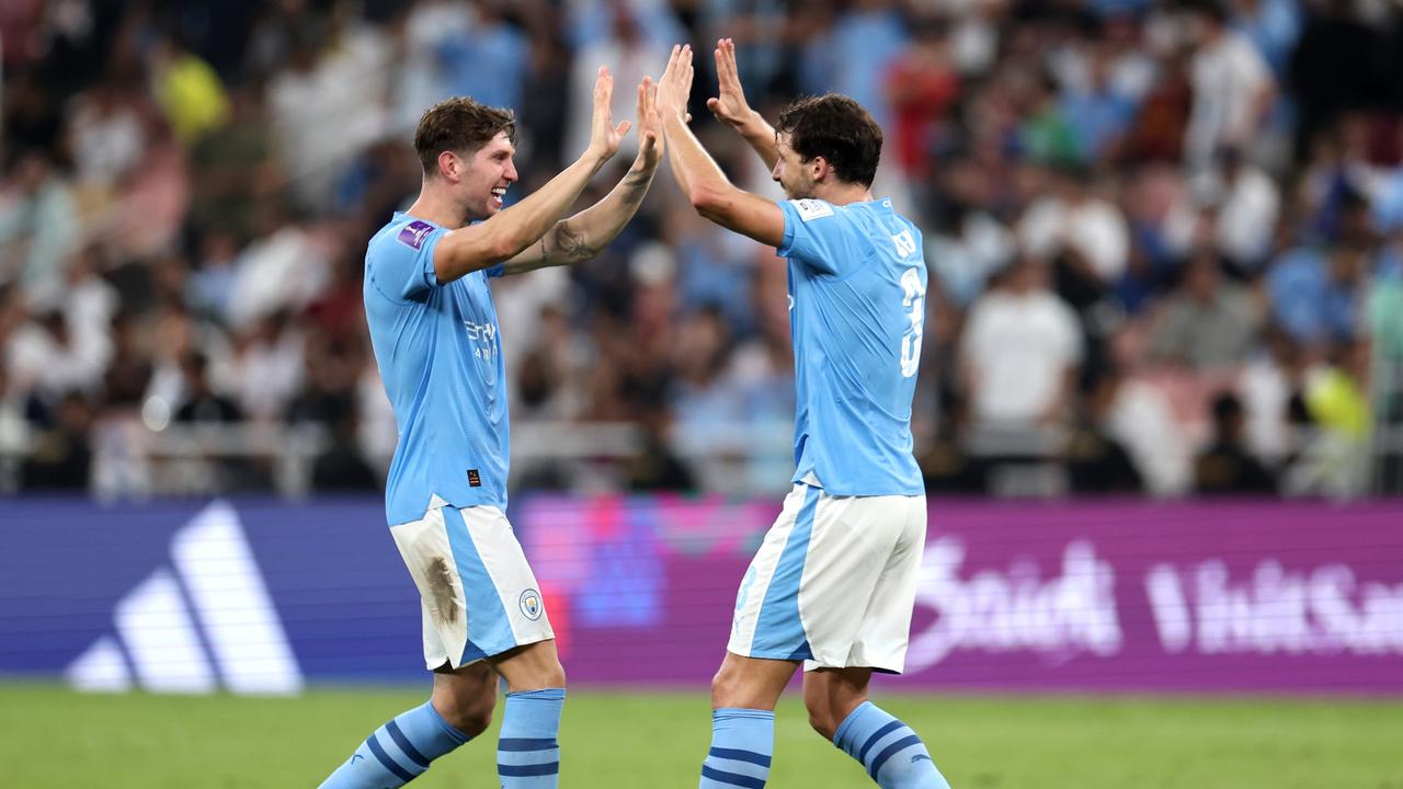 JEDDAH, SAUDI ARABIA – DECEMBER 22: John Stones and Ruben Dias of Manchester City celebrate after the team's victory in the FIFA Club World Cup Saudi Arabia 2023 Final between Manchester City and Fluminense at King Abdullah Sports City on December 22, 2023 in Jeddah, Saudi Arabia. (Photo by Francois Nel/Getty Images)