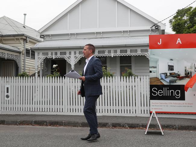 Tate Moore auctioneer. Seddon couple Tam and Anthony Bulloch, who abandoned plans to sell their home as Melbourne's tough, weeks long stage-four lockdown tanked the city's property market have sold their home today. Saturday, FEBRUARY 27, 2021. Picture: David Crosling