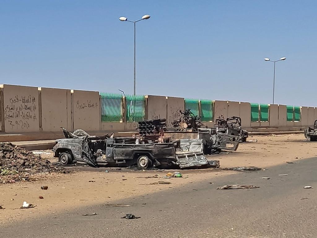 Destroyed vehicles in southern Khartoum on April 19, 2023 amid fighting between Sudan's regular army and paramilitaries following the collapse of a 24-hour truce.