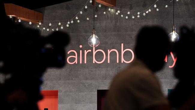 In this file photo taken on June 13, 2018 shows US rental site Airbnb logo is displayed during the company's press conference in Tokyo. (Photo by Toshifumi KITAMURA / AFP)