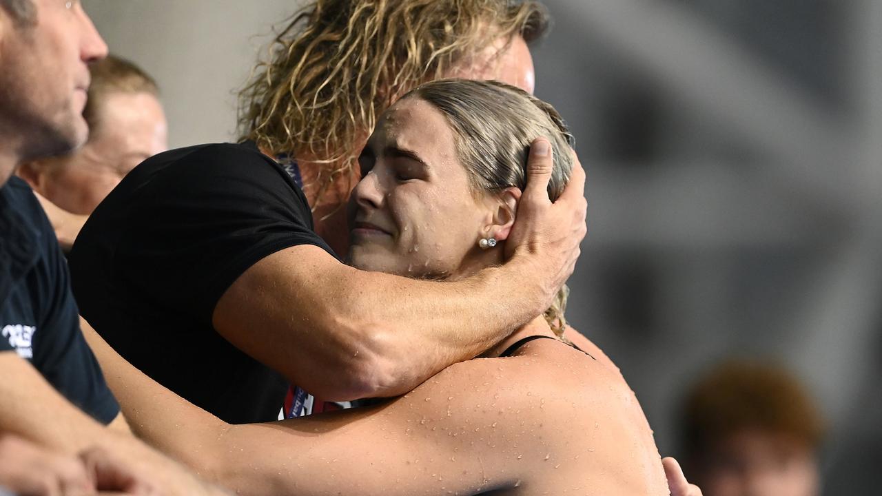 Shayna Jack of Australia hugs her coach. Photo by Quinn Rooney/Getty Images.
