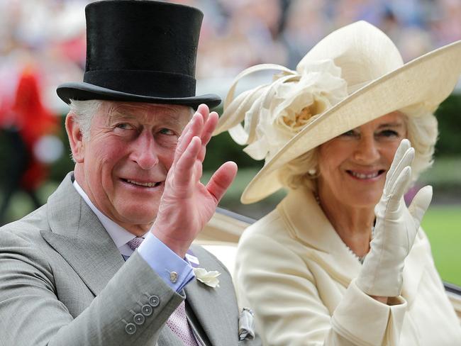 (FILES) In this file photo taken on June 19, 2018 Britain's Prince Charles, Prince of Wales (L) and his wife Britain's Camilla, Duchess of Cornwall wave as they arrive on day one of the Royal Ascot horse racing meet, in Ascot, west of London. - Prince Charles heads to Canada this week to represent head of state Queen Elizabeth II, but with more attention than ever on his future role due to his mother's age and failing health. (Photo by Daniel LEAL / AFP)