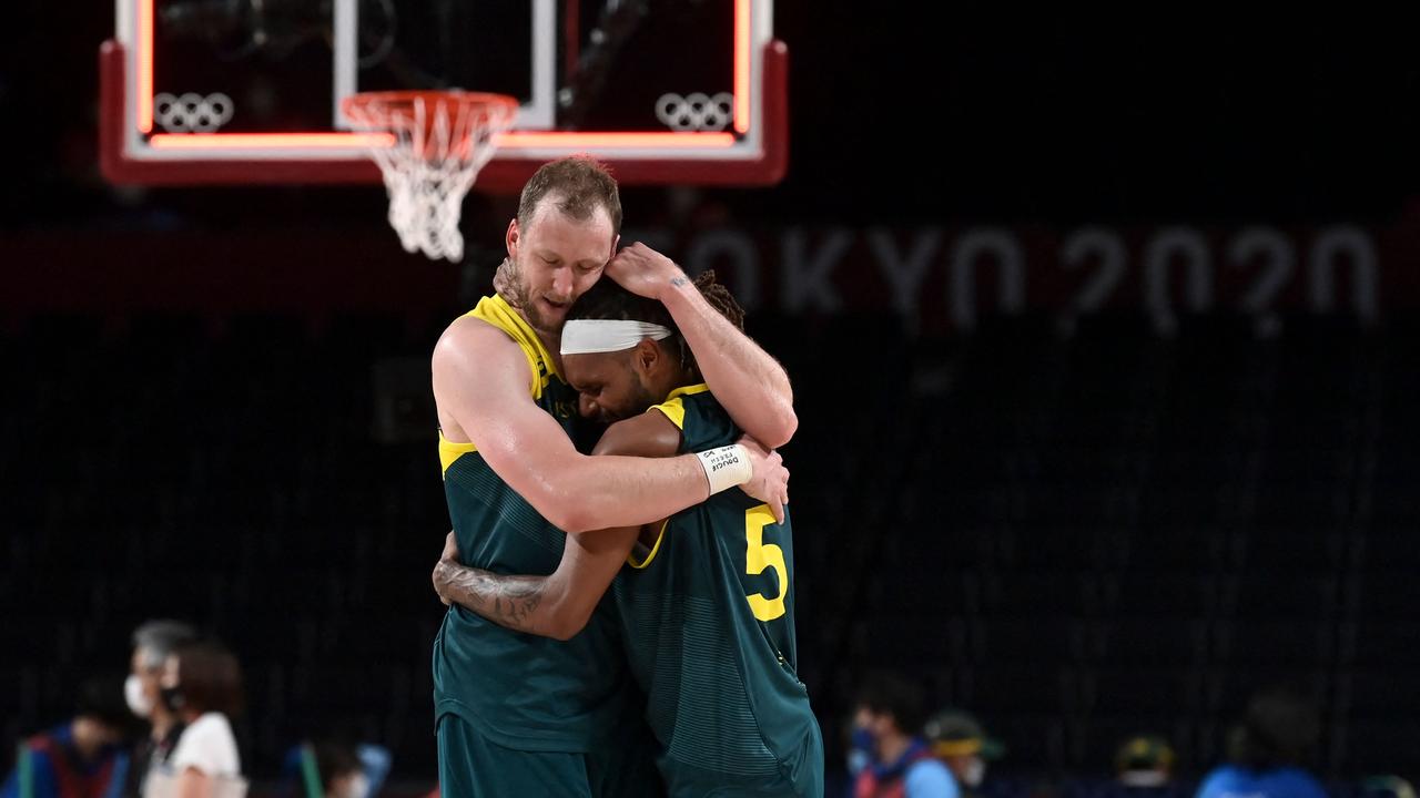 Australia’s Joe Ingles and Patty Mills embrace after winning the bronze medal game in Tokyo. Picture: AFP