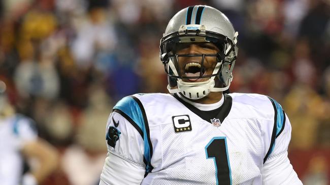 Quarterback Cam Newton celebrates the win over Washington.