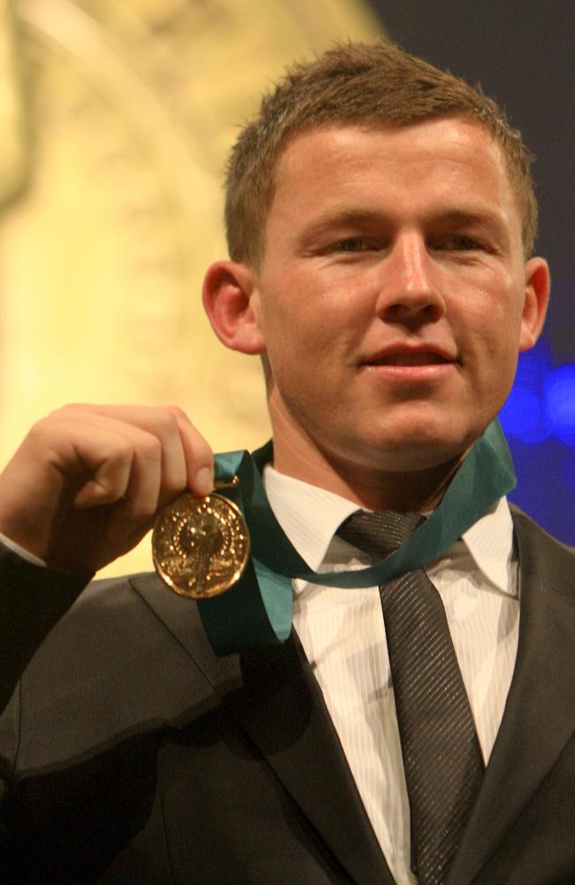 Todd Carney holds up his medal after being named Dally M Medal winner in 2010.