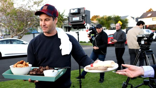 NZ First Dude Clarke Gayford delivers home cooked food to the media waiting outside Jacinda Ardern’s house in Auckland.