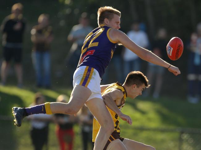 Trent Castledine spoils the ball for Vermont. Picture: Stuart Milligan