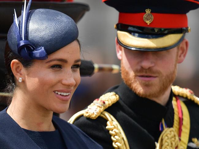 Britain's Meghan, Duchess of Sussex (L) and Britain's Prince Harry, Duke of Sussex (R) return to Buckingham Palace after the Queen's Birthday Parade, 'Trooping the Colour', in London on June 8, 2019. - The ceremony of Trooping the Colour is believed to have first been performed during the reign of King Charles II. Since 1748, the Trooping of the Colour has marked the official birthday of the British Sovereign. Over 1400 parading soldiers, almost 300 horses and 400 musicians take part in the event. (Photo by Daniel LEAL-OLIVAS / AFP)